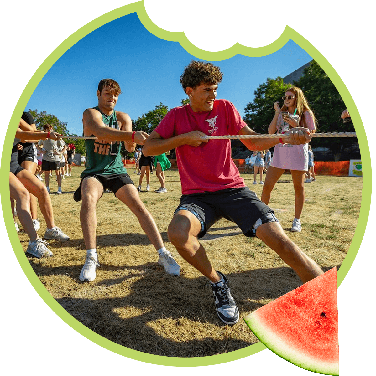 People playing tug-of-war outdoors.